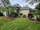 One-story home with landscaped yard and attached garage at 3840 Eversholt St, Clermont, FL 34711