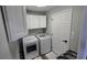 Laundry room with washer, dryer, and cabinets at 3840 Eversholt St, Clermont, FL 34711