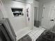 Clean shower with tiled walls and built-in shelves at 3840 Eversholt St, Clermont, FL 34711