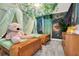 Charming ' bedroom with twin beds, whimsical decor, and a forest mural at 4299 Paragraph Dr, Kissimmee, FL 34746