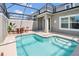 Private screened pool and patio with outdoor furniture at 4299 Paragraph Dr, Kissimmee, FL 34746