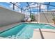 Relaxing pool area with covered patio and lounge chairs at 4299 Paragraph Dr, Kissimmee, FL 34746