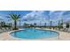 Large resort-style pool with plenty of lounge chairs at 4299 Paragraph Dr, Kissimmee, FL 34746