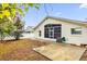 Backyard view of home with patio and screen enclosure at 4382 Weeping Willow Cir, Casselberry, FL 32707