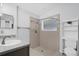 Bathroom includes a shower and toilet, plus shelving at 4382 Weeping Willow Cir, Casselberry, FL 32707