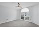 Bedroom featuring an arched window and ceiling fan at 4382 Weeping Willow Cir, Casselberry, FL 32707