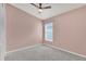 Bedroom with neutral walls, ceiling fan and window at 4382 Weeping Willow Cir, Casselberry, FL 32707