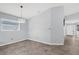 Simple dining area with tile flooring and access to the kitchen at 4382 Weeping Willow Cir, Casselberry, FL 32707