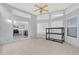 Sunroom with kitchen view and storage shelving at 4382 Weeping Willow Cir, Casselberry, FL 32707