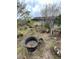 Overgrown backyard with several containers and debris at 5238 Macadamia Ct, Orlando, FL 32818