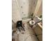 Bathroom with tub, toilet and sink, cluttered at 5238 Macadamia Ct, Orlando, FL 32818