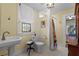 Bathroom with pedestal sink, tiled floor and shower at 549 Glenway Dr, Sanford, FL 32771