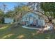 Side view of light blue house with shed and yard at 549 Glenway Dr, Sanford, FL 32771