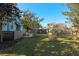 Side yard of light blue house with fence at 549 Glenway Dr, Sanford, FL 32771