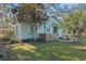 Backyard view of light blue house with shed at 549 Glenway Dr, Sanford, FL 32771