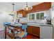 Modern kitchen featuring wooden cabinets, white subway tile backsplash, and farm sink at 549 Glenway Dr, Sanford, FL 32771