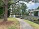 Peaceful community path with pond and bridge views at 5801 Windhover Dr # A01, Orlando, FL 32819