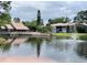 Community features a pond, fountain, and condo buildings at 5801 Windhover Dr # A01, Orlando, FL 32819