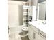 Bathroom with tub, toilet and vanity with white cabinets at 5814 Bimini Twist Loop, Orlando, FL 32819