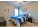 Bright bedroom with striped bedding and ample natural light at 5814 Bimini Twist Loop, Orlando, FL 32819