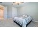 Bright bedroom with double doors to hallway and carpet flooring at 5814 Bimini Twist Loop, Orlando, FL 32819