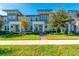 Modern townhouses with landscaped yards and brick walkways at 5814 Bimini Twist Loop, Orlando, FL 32819