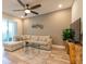 Comfortable living area featuring a sectional sofa and large TV at 5814 Bimini Twist Loop, Orlando, FL 32819