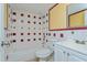 Bathroom with tiled tub and vanity at 5896 Peregrine Ave # C01, Orlando, FL 32819