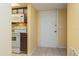 Entryway with kitchen and interior door at 5896 Peregrine Ave # C01, Orlando, FL 32819