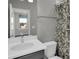 Modern bathroom with single sink vanity and shower/tub combo at 609 Bayhawk St, Debary, FL 32713