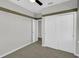 Spacious bedroom with double door closet and carpet flooring at 609 Bayhawk St, Debary, FL 32713