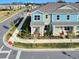 Two-story townhome with light blue and gray siding, and manicured landscaping at 609 Bayhawk St, Debary, FL 32713