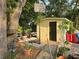 Backyard with shed, basketball hoop, and various plants at 6254 Balboa Dr, Orlando, FL 32808