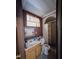 Small bathroom with shower and wooden vanity at 6254 Balboa Dr, Orlando, FL 32808