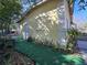 Home's exterior showing stucco finish and a landscaped walkway leading to the entrance at 6254 Balboa Dr, Orlando, FL 32808