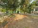 Lawn and trees in front of a home with shade and some landscaping at 6254 Balboa Dr, Orlando, FL 32808