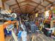 View of a messy storage shed with an abundance of tools and materials at 6254 Balboa Dr, Orlando, FL 32808