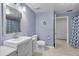 Clean bathroom with white vanity, shower, and toilet at 6663 Queens Borough Ave # 108, Orlando, FL 32835