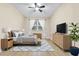 Spacious bedroom with light wood flooring and plenty of natural light at 6663 Queens Borough Ave # 108, Orlando, FL 32835