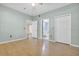 Bedroom with hardwood flooring and access to bathroom at 6663 Queens Borough Ave # 108, Orlando, FL 32835