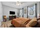 Bedroom with wood flooring and neutral color palette at 6663 Queens Borough Ave # 108, Orlando, FL 32835