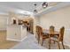 Kitchen dining area with a table and chairs, adjacent to the kitchen at 6663 Queens Borough Ave # 108, Orlando, FL 32835