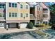 Condo building exterior showcasing building entrance and parking spaces at 6663 Queens Borough Ave # 108, Orlando, FL 32835