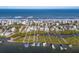 Panoramic aerial view of waterfront homes, Intracoastal waterway and boat docks at 6912 S Atlantic Ave, New Smyrna Beach, FL 32169