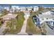 Aerial view of the neighborhood showcasing beach houses with a long driveway leading to the featured home at 6912 S Atlantic Ave, New Smyrna Beach, FL 32169