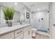 Modern bathroom with a glass shower, white cabinets, and a stylish vanity at 6912 S Atlantic Ave, New Smyrna Beach, FL 32169