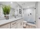 Bathroom with white vanity, shower, and modern fixtures at 6912 S Atlantic Ave, New Smyrna Beach, FL 32169