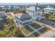 Stunning elevated beach house featuring a spacious yard, balconies, and scenic views at 6912 S Atlantic Ave, New Smyrna Beach, FL 32169
