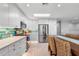 This kitchen features stainless steel appliances, lots of natural light, and eating space at 6912 S Atlantic Ave, New Smyrna Beach, FL 32169