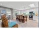 Open concept living space featuring a dining room table, kitchen, and lots of natural light at 6912 S Atlantic Ave, New Smyrna Beach, FL 32169